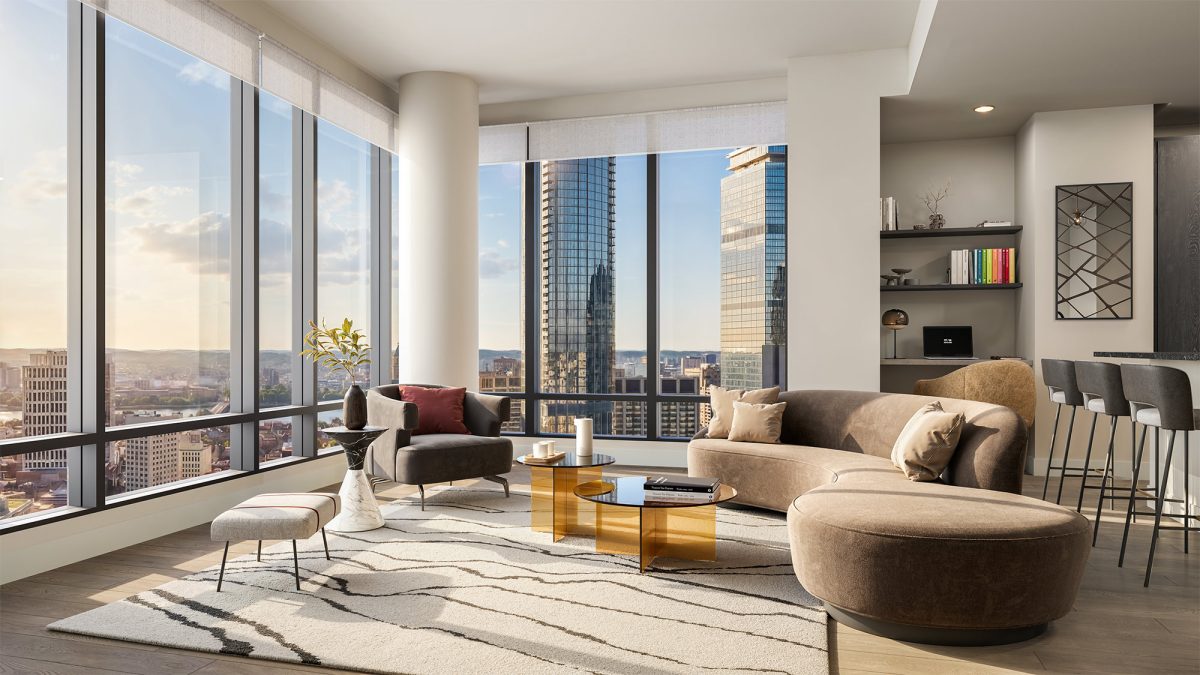 Spacious living room with panoramic city views and floor-to-ceiling windows