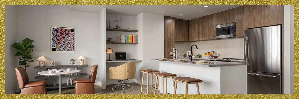 Modern kitchen and dining area with wood cabinetry, island seating, and decor