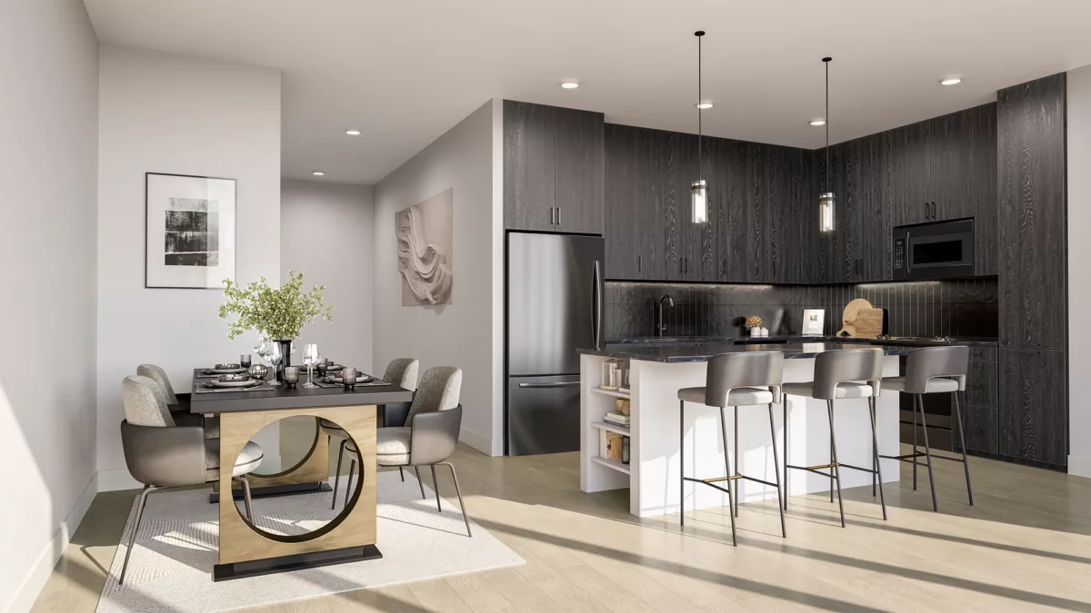 Open-concept kitchen and dining area with dark cabinetry and island seating.